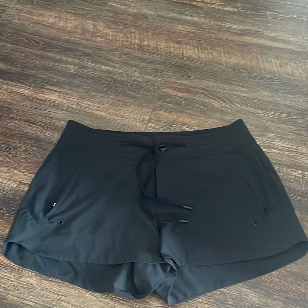 Athleta size 2 black athletic shorts with zipper pocket and tie